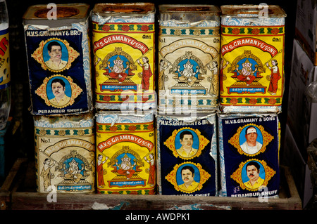 Rusting snuff tins for sale in a small grocery shop, Kerala, India. Stock Photo