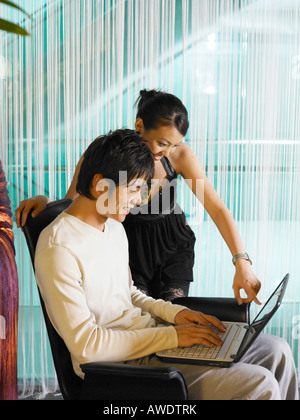 couple using laptop in the cafe Stock Photo