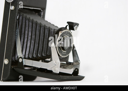 An old style bellows camera against a white background. Stock Photo