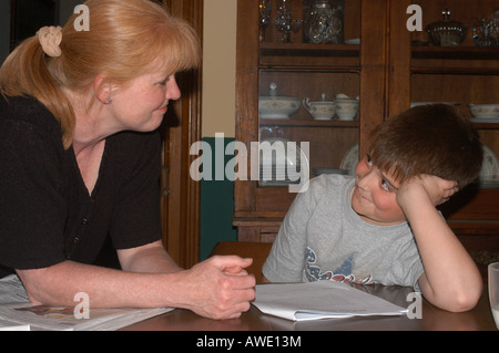 Mother and seven year old son doing homework Ohio USA Stock Photo