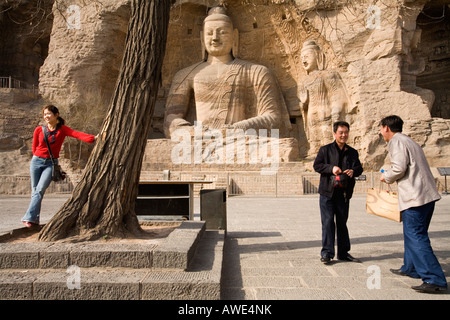 Buddahs carved out of the rock. Yungang caves, Shanxi Province, People