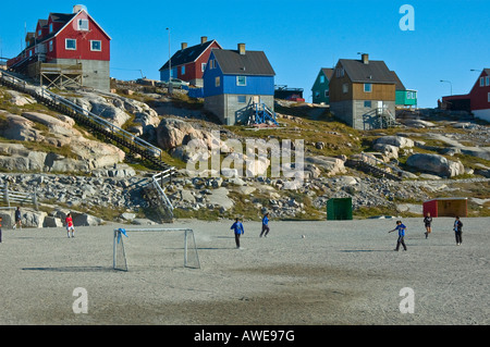 Children playing at a football field in Ilulissat, Greenland, North Atlantic Stock Photo