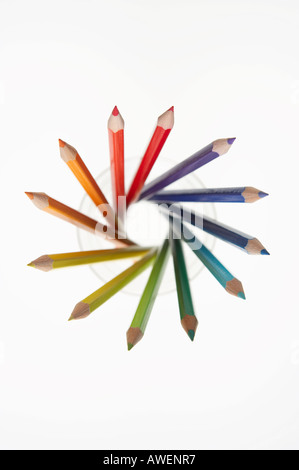 SELECTION OF COLOURED PENCILS IN GLASS TUMBLER Stock Photo