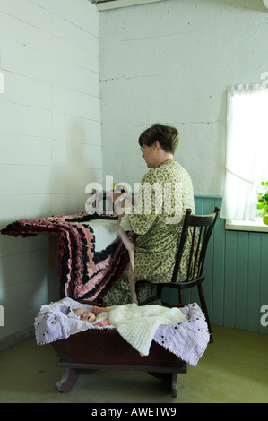 A sewing demonstration using an old sewing machine at The Mennonite Heritag Village in Steinbach, Manitoba Canada Stock Photo