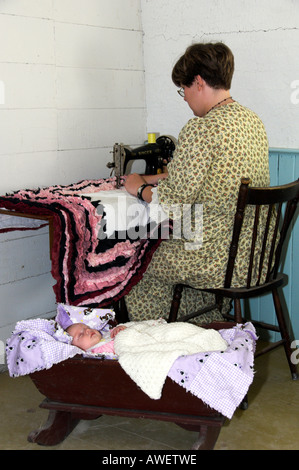 A sewing demonstration using an old sewing machine at The Mennonite Heritag Village in Steinbach, Manitoba Canada Stock Photo