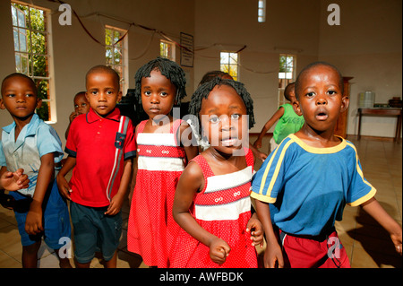 Children, twins singing and dancing at a kindergarten, Gaborone, Botswana, Africa Stock Photo