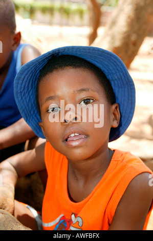 Boy wearing blue hat, Gaborone, Botswana, Africa Stock Photo