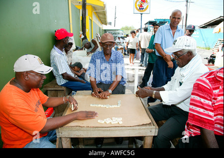 Men playing dominos at the market square in Georgetown, Guyana, South America Stock Photo