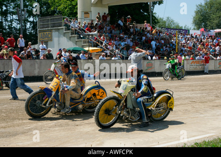 Sidecar motorcycles at the starting line, international motorcycle race on a dirt track speedway in Muehldorf am Inn, Upper Bav Stock Photo