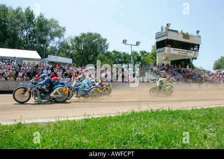 Sidecar motorcycles at the starting line, international motorcycle race on a dirt track speedway in Muehldorf am Inn, Upper Bav Stock Photo