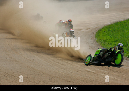 Sidecar motorcycles, international motorcycle race on a dirt track speedway in Muehldorf am Inn, Upper Bavaria, Bavaria, German Stock Photo