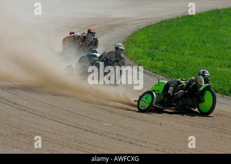 Sidecar motorcycles at an international motorcycle race on a dirt track speedway in Muehldorf am Inn, Upper Bavaria, Bavaria, G Stock Photo