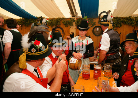 Men dressed in national costume in a beer tent at a folk festival in Muehldorf am Inn, Upper Bavaria, Bavaria, Germany, Europe Stock Photo