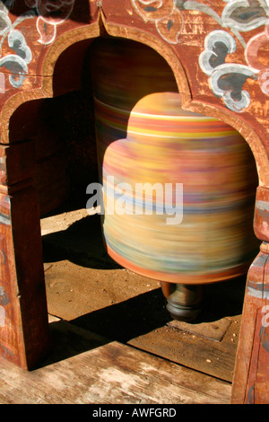 Moving effect of a Tibetan spinning prayer wheels, Bhutan Stock Photo