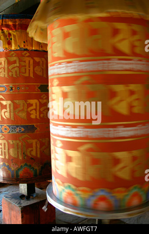 Tibetan spinning prayer wheels, Bhutan Stock Photo