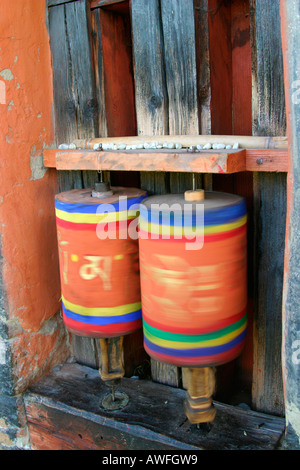 Tibetan spinning prayer wheels, Bhutan Stock Photo