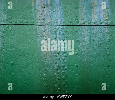 Green metal surface with rivets Stock Photo