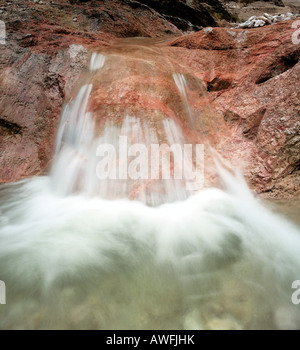 Akaka Falls, red river rocks, Hawaii, USA Stock Photo