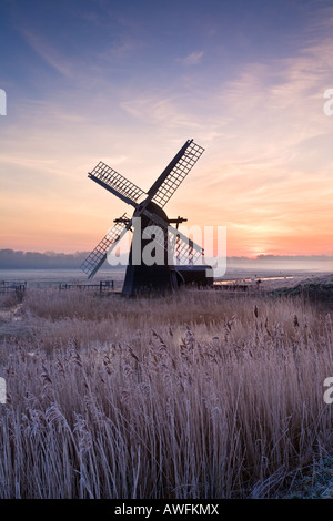 Cold Hoar Frosted sunrise at Herringfleet windmill on the Norfolk & Suffolk Broads Stock Photo