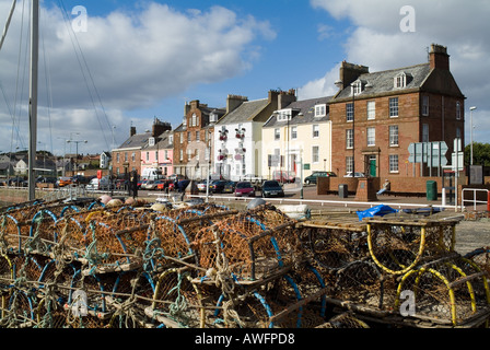 dh Arbroath harbour ARBROATH ANGUS Fishing creels alongside quay side and row of harbour houses Stock Photo
