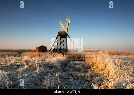 Cold Hoar Frosted sunrise at Herringfleet windmill on the Norfolk & Suffolk Broads Stock Photo