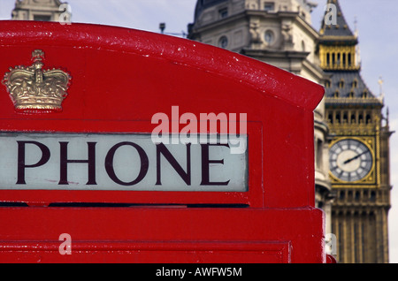 A view of Londons Houses of Parliament with a red telephone booth in the foreground Stock Photo