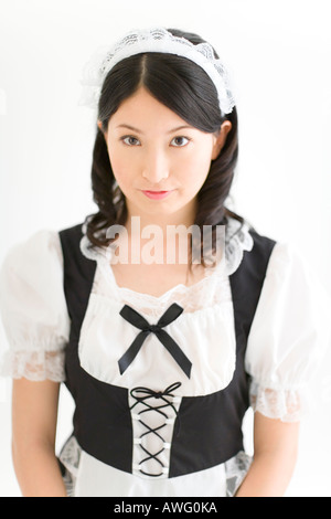 A young woman in French maid outfit smiling Stock Photo - Alamy