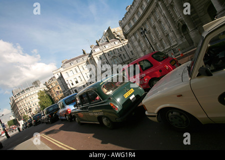 Multi coloured London taxi cabs cars stationary in congestion trafiic jam central London England UK EU Stock Photo