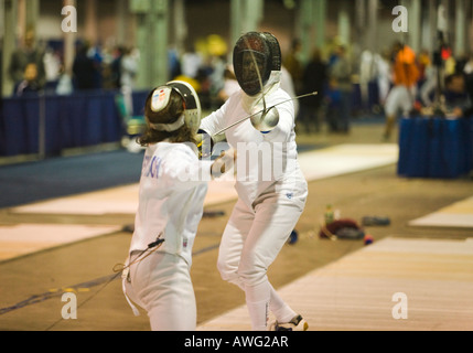 SPORTS Fencing competition two women competing on strip using epee weapon in tournament Stock Photo