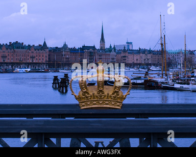 A gilded tre kronor crown, national emblem of Sweden, on Skeppsholmsbron (Skeppsholm Bridge), in Stockholm, Sweden. Stock Photo