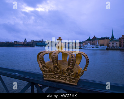 A gilded tre kronor crown, national emblem of Sweden, on Skeppsholmsbron (Skeppsholm Bridge), in Stockholm, Sweden. Stock Photo