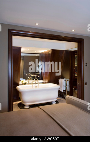 en-suite bathroom seen from bedroom in a London apartment, interior design by Keech Green Stock Photo