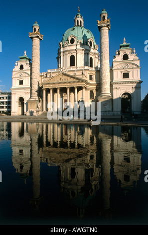 Austria, Vienna, Karlskirche, façade of St.Karl's Church, with dome, column and monumental Greek portico reflected in waters Stock Photo