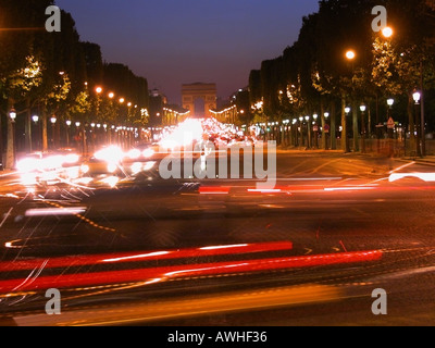 Looking up the Champs Elysees towards the Arc de Triomphe at night Paris Stock Photo