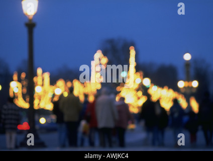 France, Paris, people and illuminations at night, blurred Stock Photo