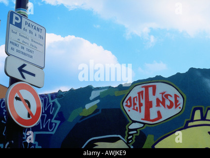 Street signs and graffiti. Stock Photo