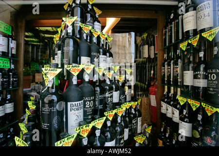 Image showcasing Bottles of wine are on display at a liquor store in Cremona, Alta ...