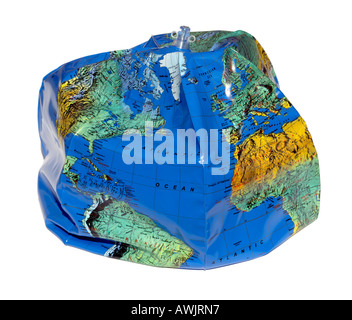 Deflated Earth Globe cut out on white background Stock Photo - Alamy