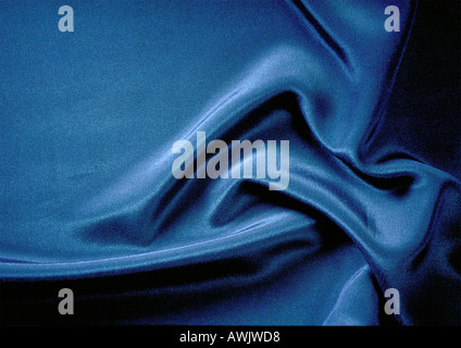 Folds in silky blue fabric, close-up, full frame Stock Photo