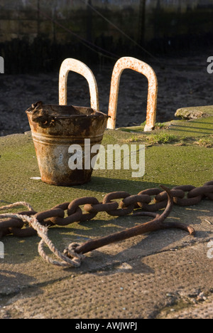 Bucket, Anchor and Chain on Burnmouth harbour wall, Scotland Stock Photo