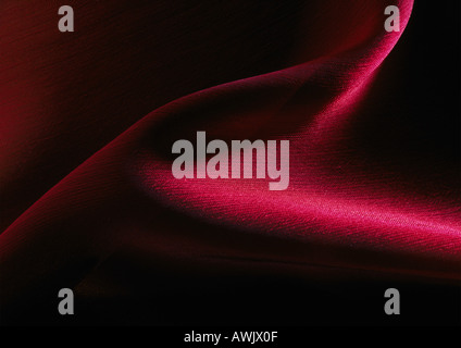 Fold in crimson satin, close-up, full frame Stock Photo