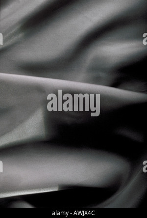Folds in grey fabric, close-up, full frame Stock Photo