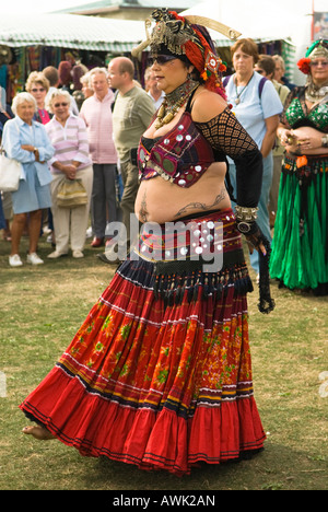 Swanage Folk Festival, fat flamboyant belly dancer, spectacular dress, troupe performing in show grounds, September,Swanage, Dorset, UK, Stock Photo
