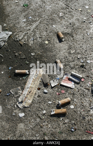 cigarette stubs on road Stock Photo