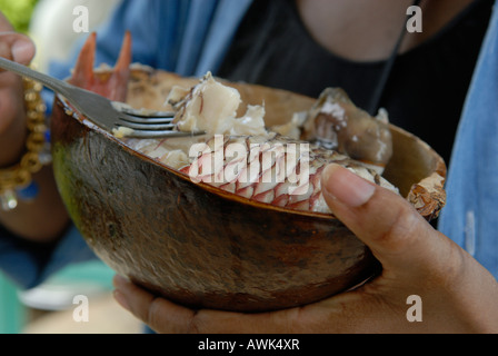 fish stew (court bouillon) served with bananas, breadfruit and avocados in a calabash bowl, creole cuisine Stock Photo