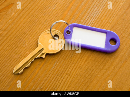 Close up view of a bunch of keys against a wooden background Stock Photo