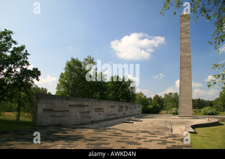 The Obelisk and Inscription Wall in the main memorial area of the former Nazi concentration camp at Bergen Belsen, Germany. Stock Photo