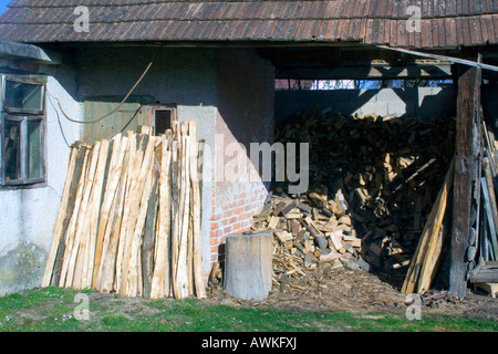 Fire wood stacked in the hut. Stock Photo