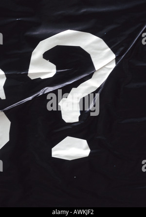 ? text, printed in white on wrinkled black surface Stock Photo