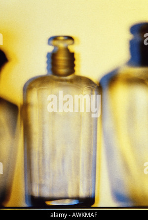 Glass perfume bottles, close-up, blurred Stock Photo